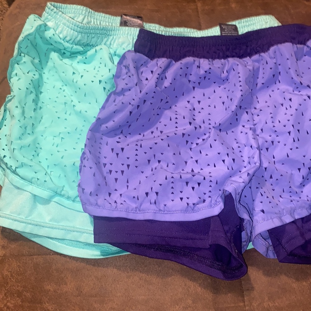 Two pairs of shorts. Same style and size.